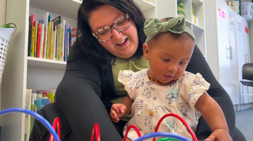 mother playing with her baby BabiesAndBeyondWi.org - Baby Care Packages