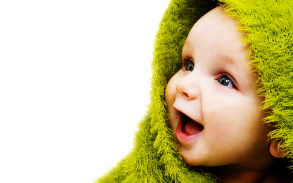 baby wrapped in a lime green blanket