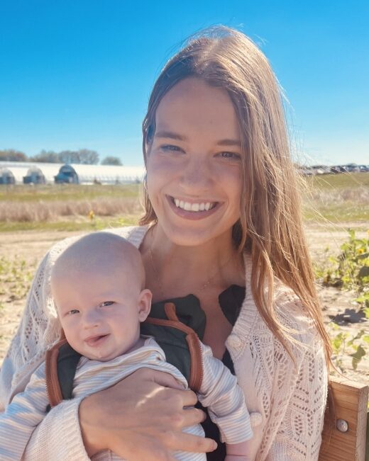 Babies & Beyond Board Member Taylor Hauser with her happy baby